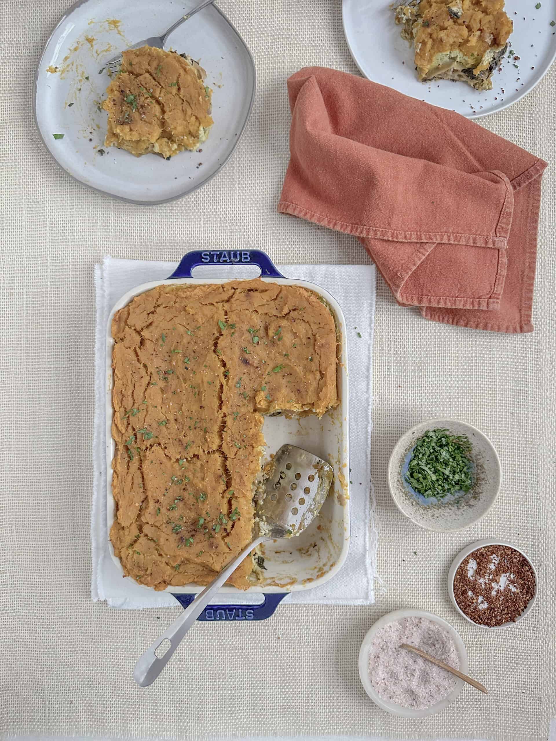 butternut squash on the dinner table with two plates filled with the lasagna