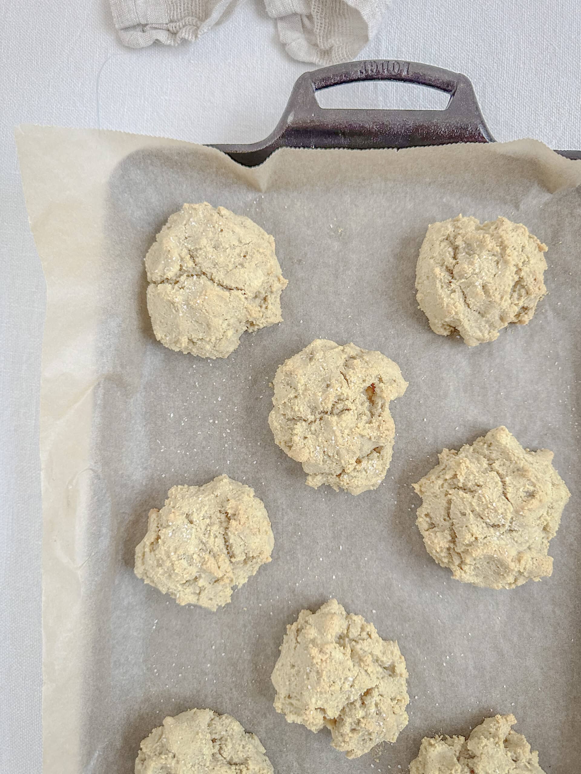almond flour biscuits on a rimmed baking sheet